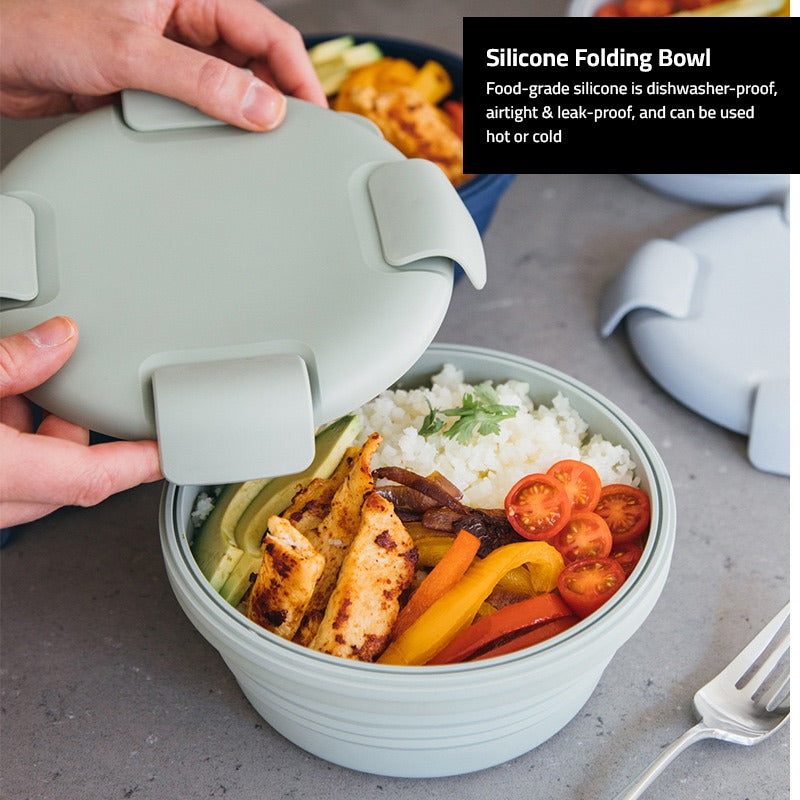 A Person is Opening Silicone Bowl Food Container With Lunch  on it.