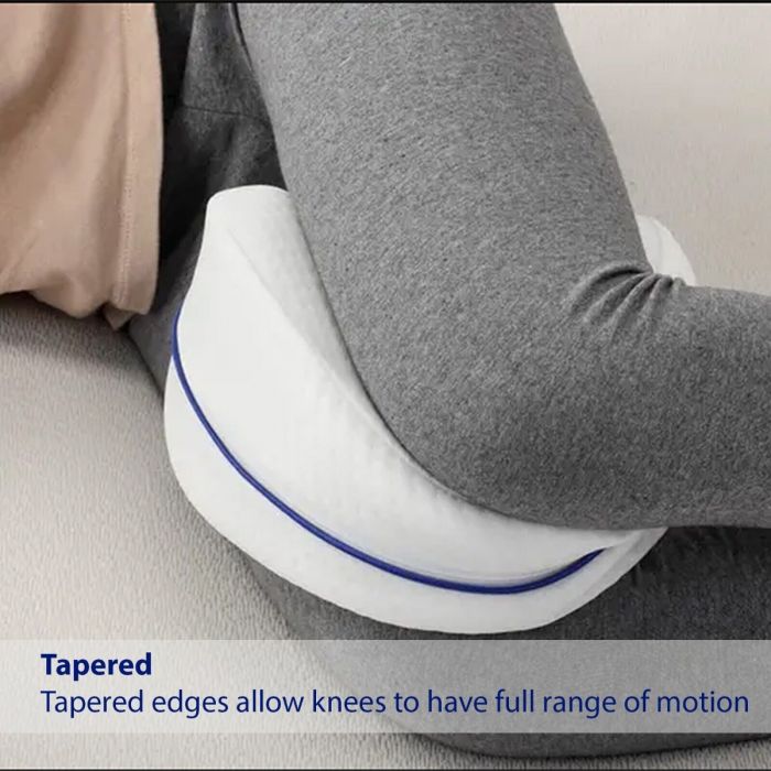 A Person is Using  Orthopedic Sleeping Leg Pillow.