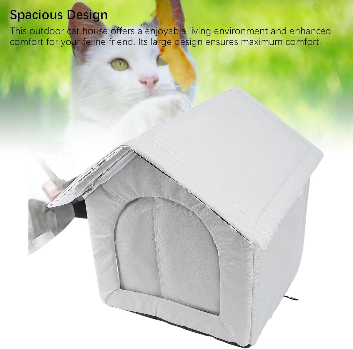 Cat peeking out from a gray outdoor cat house with greenery in the background