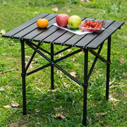 Outdoor Folding Camping Picnic Table with Fruits Placed in a Outdoor Setup.