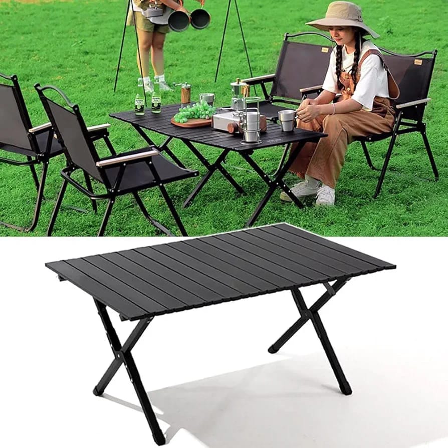 Outdoor Portable Camping Table with fruits,snacks and drinks placed on top of it being used by a women in a picnic at a park