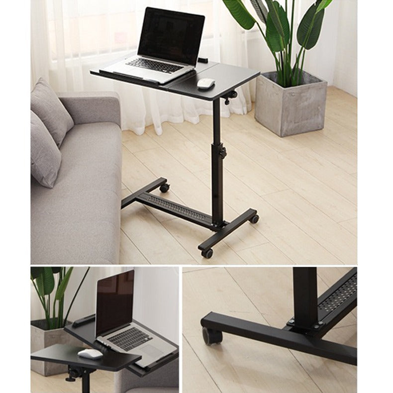 Black Adjustable Overbed Laptop Stand Table with a laptop on top, positioned on the floor next to a sofa