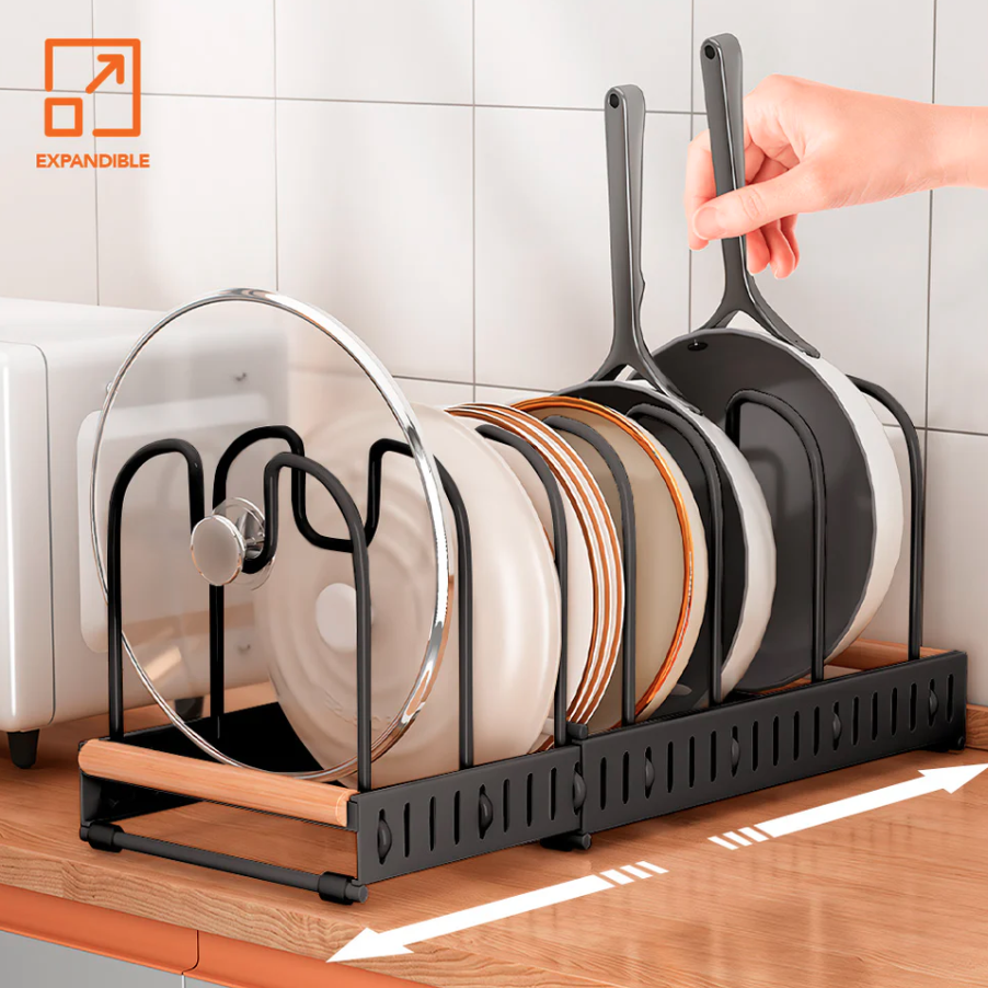 A Person is Taking Pan From Expandable Pot and Pan Organizer Rack Organized with Pans and Plates.