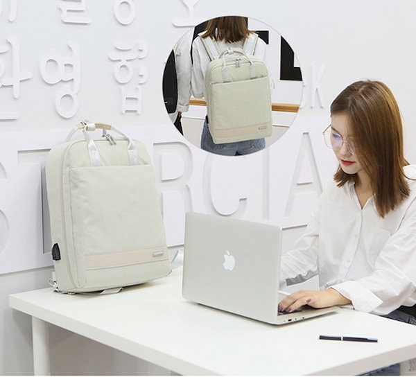 A Women is Using Stylish  Laptop Backpack with USB Charging To Keep Her Laptop.