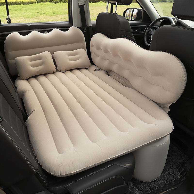 Beige Portable Travel Inflatable Car Bed placed in a car