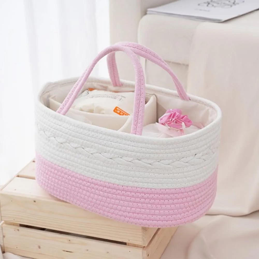 Pink color Nursery Storage Basket  filled with baby accessories kept on top of a table 