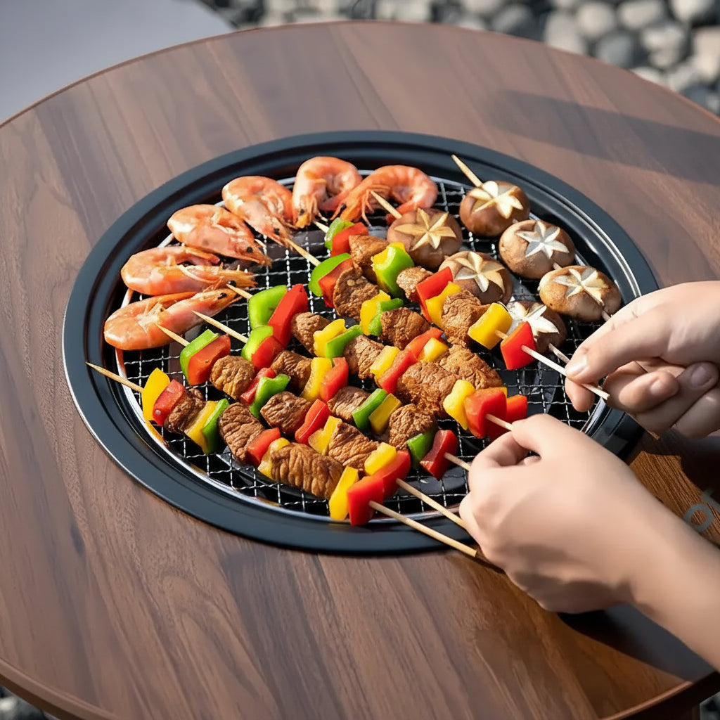 Person grilling skewered meats and vegetables on Porodo Lifestyle Outdoor Round Grill Table 