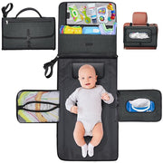 A Baby is Lying On the Portable Diaper Changing Travel Mat Bag Organized with Baby Essentials.