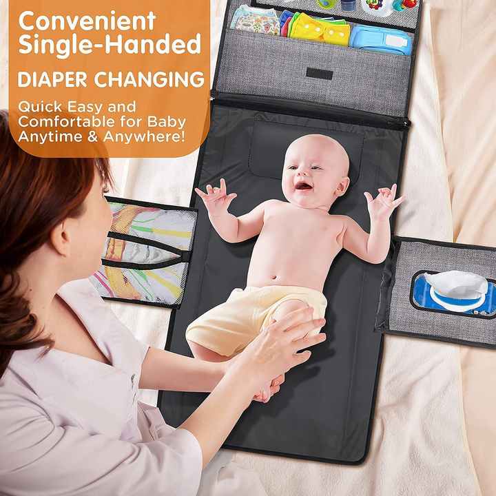 A Women is Changing Diaper Of Baby Using Portable Diaper Changing Travel Mat Bag.
