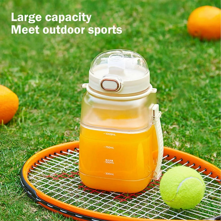 Portable Electric Juicer Blender Cup Filled With Juice.