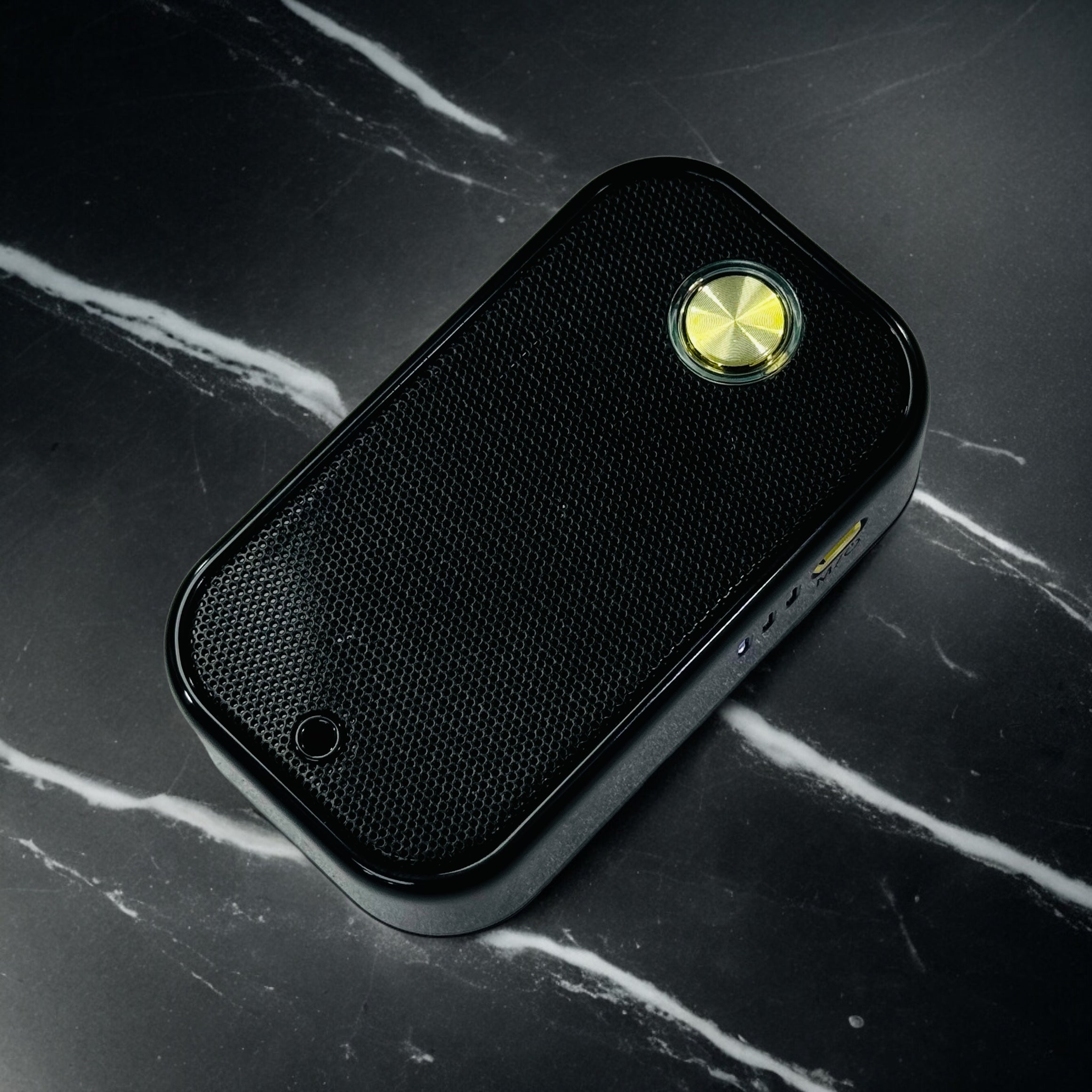 Portable Electric Oud Oil Bukhoor Burner on a dark marble surface