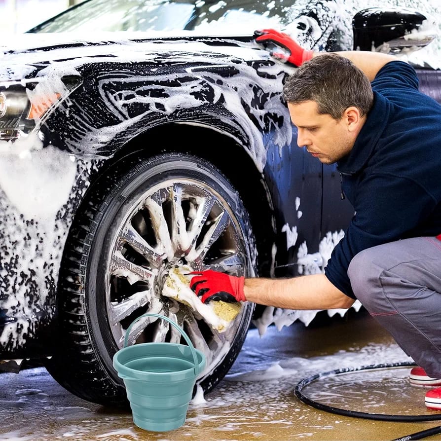 A Person is Washing Car Using Portable Folding Bucket.