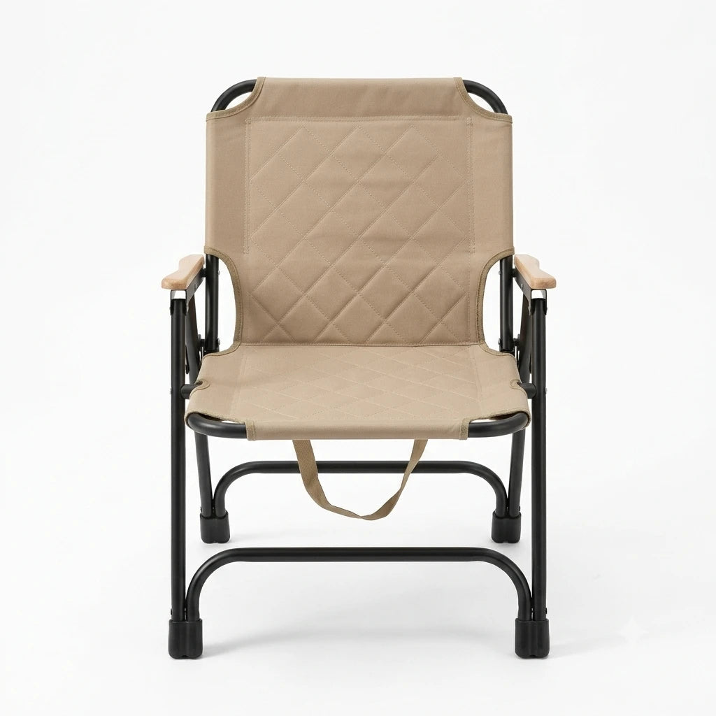 A folding camp chair with a beige quilted fabric seat and backrest, supported by a black metal frame with light wood armrests, shown against a plain white background.