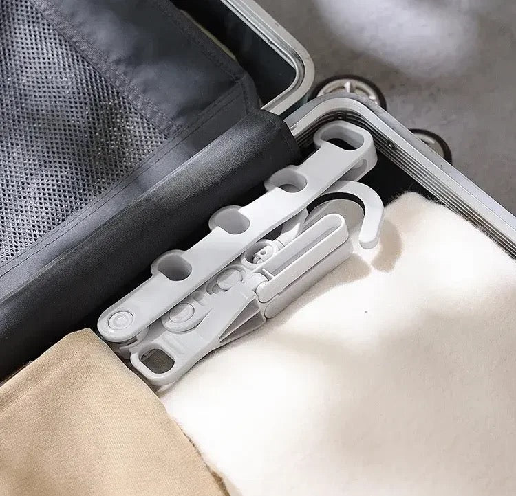 Portable Foldable Clothes Hanger placed in a suitcase