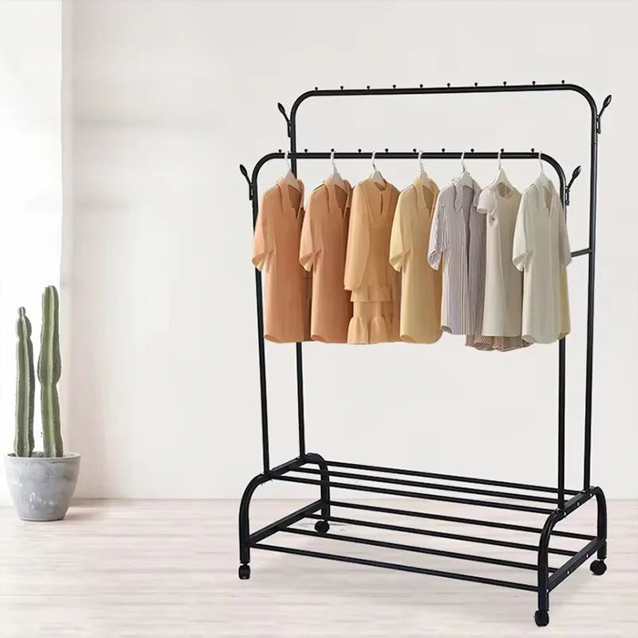 Black clothing rack with shirts on a white background