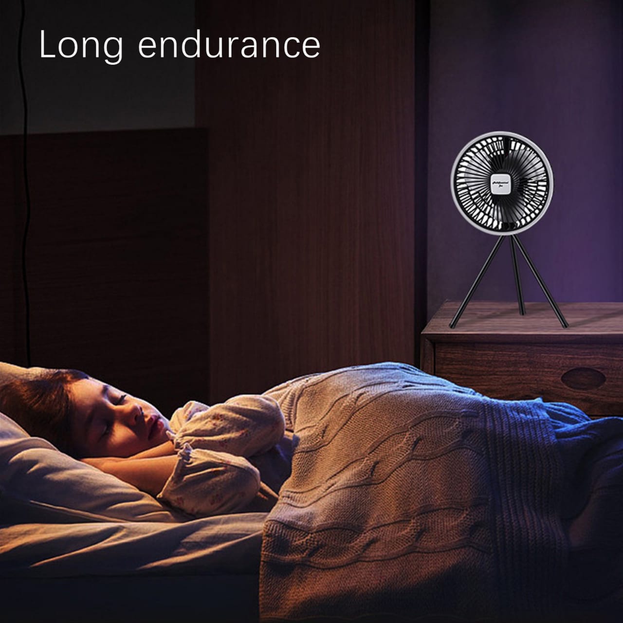 A Child is Sleeping Peacefully By Placing Portable Mini Fan Near Bed.