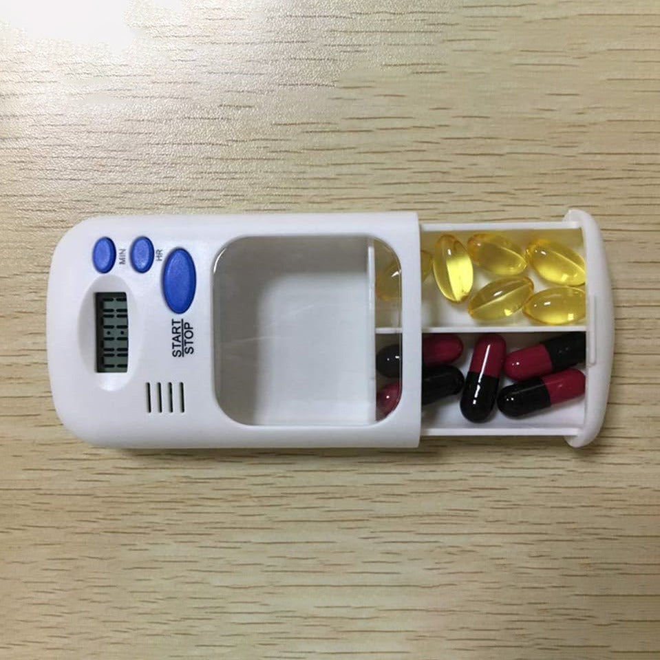 The Portable Mini Travel Carry Pill Box in white color is placed on the table, carrying some pills
