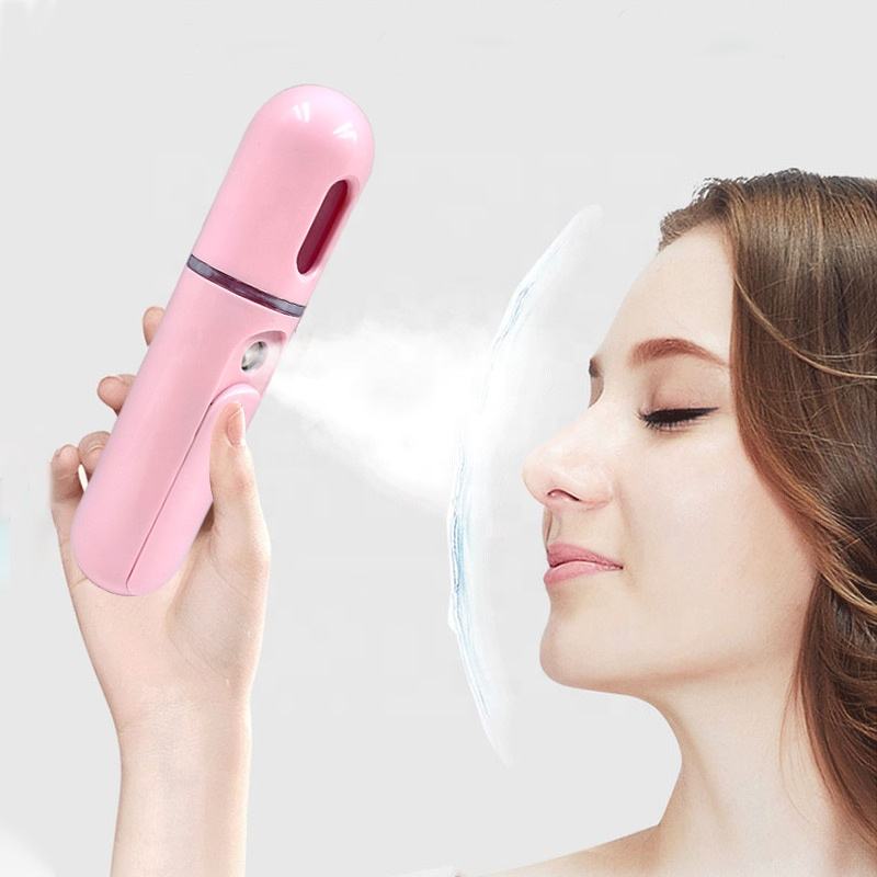 A Woman is Spraying Portable Nano Facial Mist Sprayer.