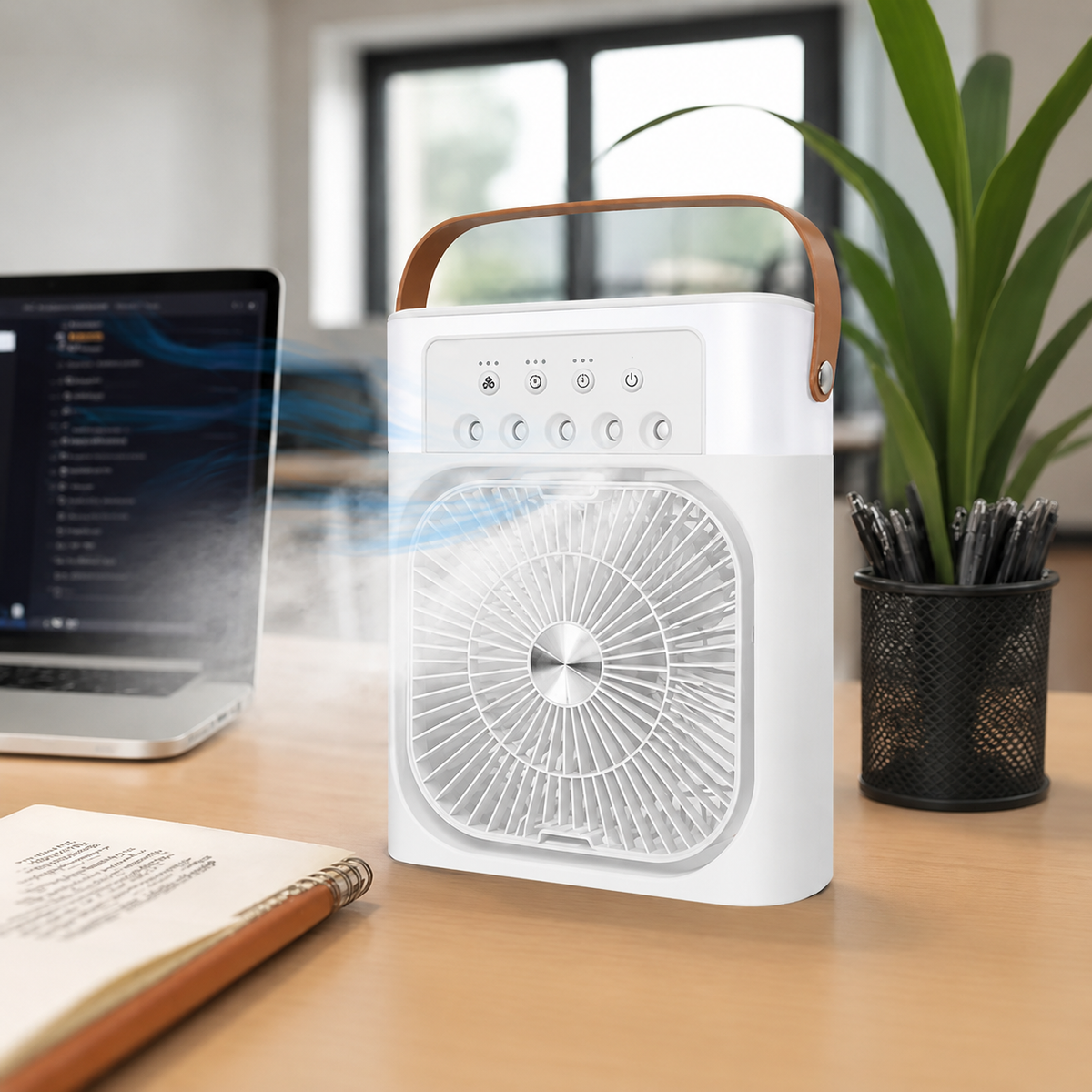 Portable Rechargeable Spray Fan on a desk with a laptop and office supplies in the background