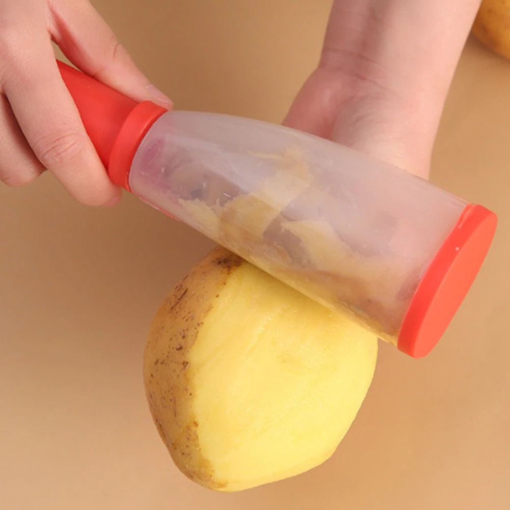 A Person Is Peeling Potato With Stainless Steel Peeler.