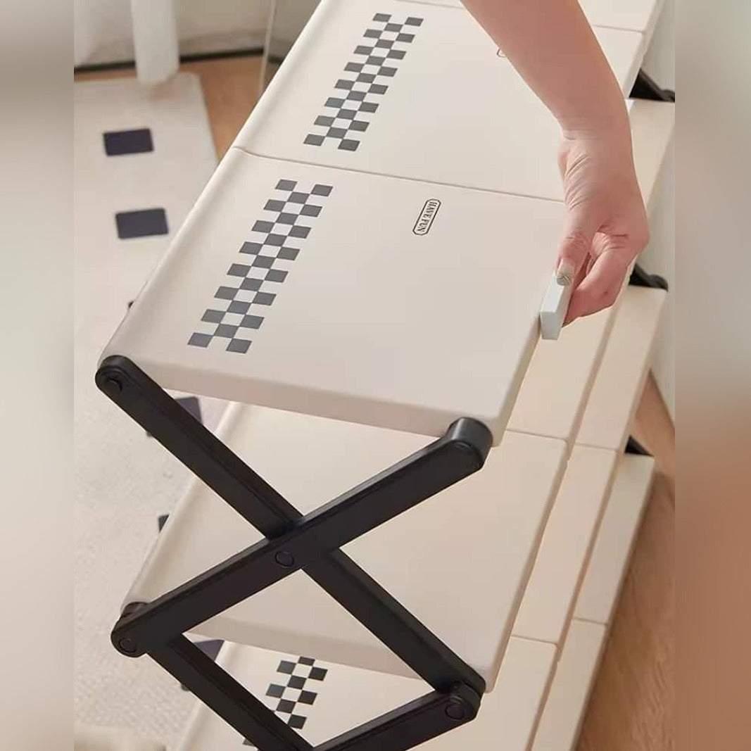 Someone trying to fold the Foldable Multi-Layer Shoe Rack Shelf