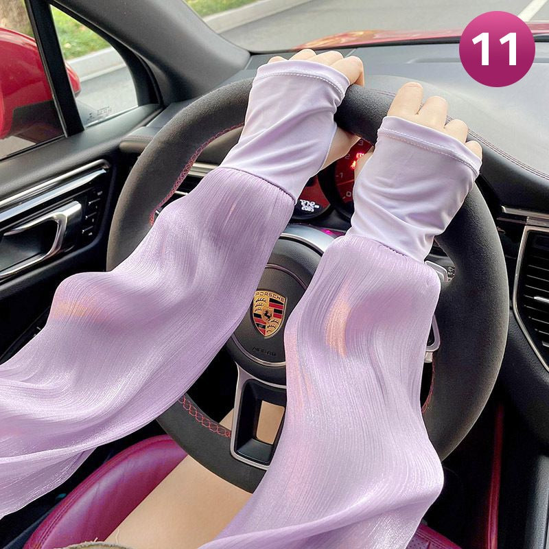 A Women is Wearing Women Summer Arm Sleeves While Driving.