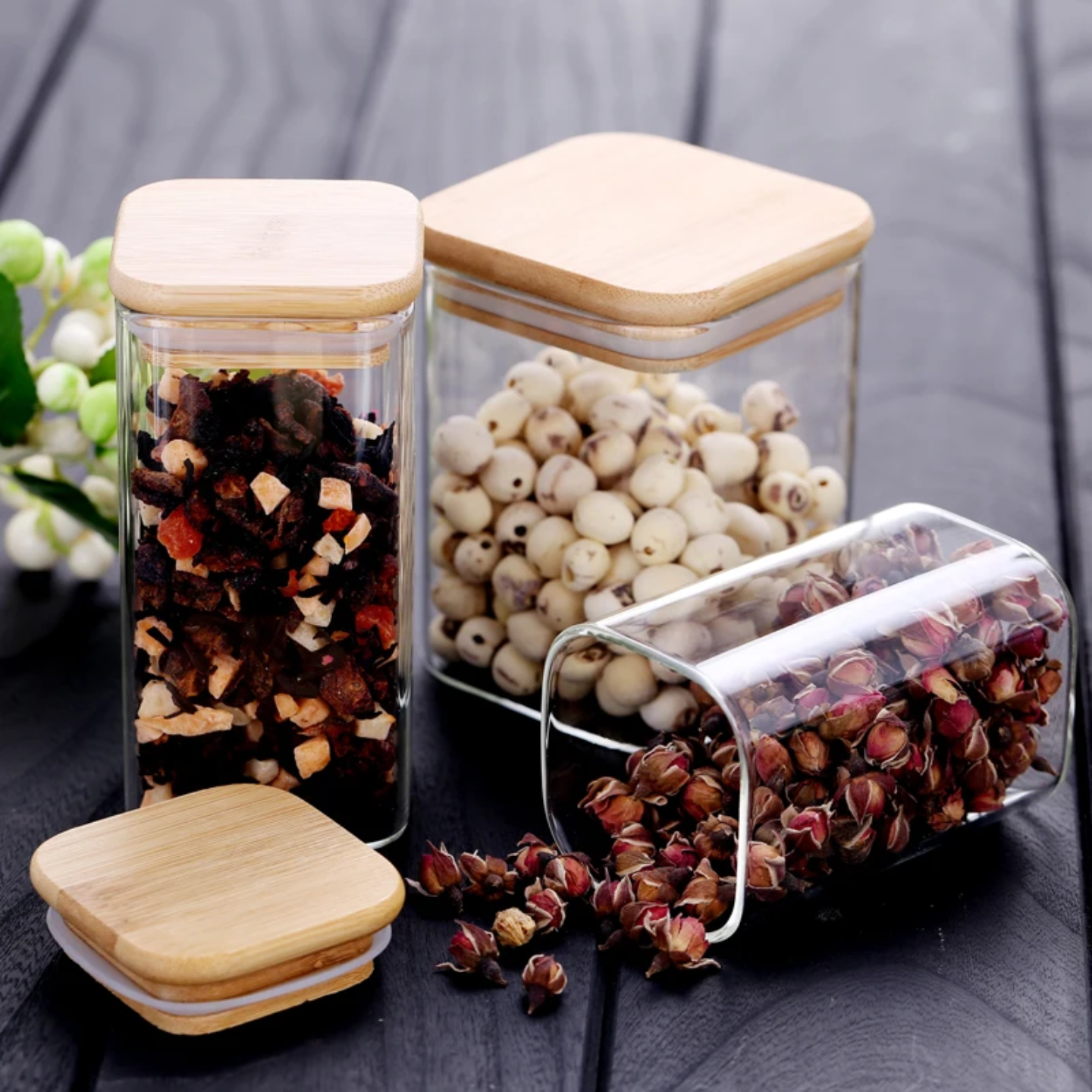 A Set Of Glass Storage Jars  are Filled with Snacks