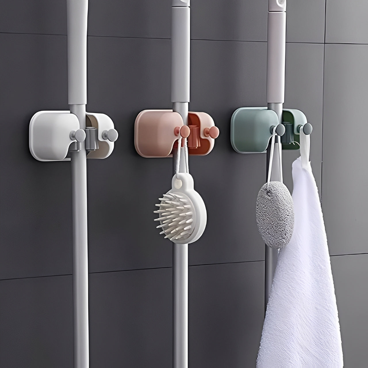 Wall Mounted Single Mop Holders Holding Mops Attached on Wall.