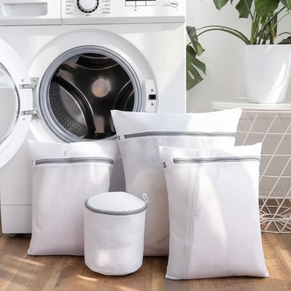 4 Pcs  Mesh Laundry Washing Bags Set in front of a washing machine.
