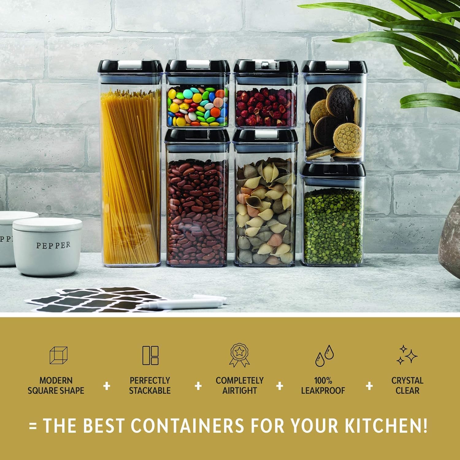 Set of kitchen storage containers with food items on a countertop, featuring text about container features.