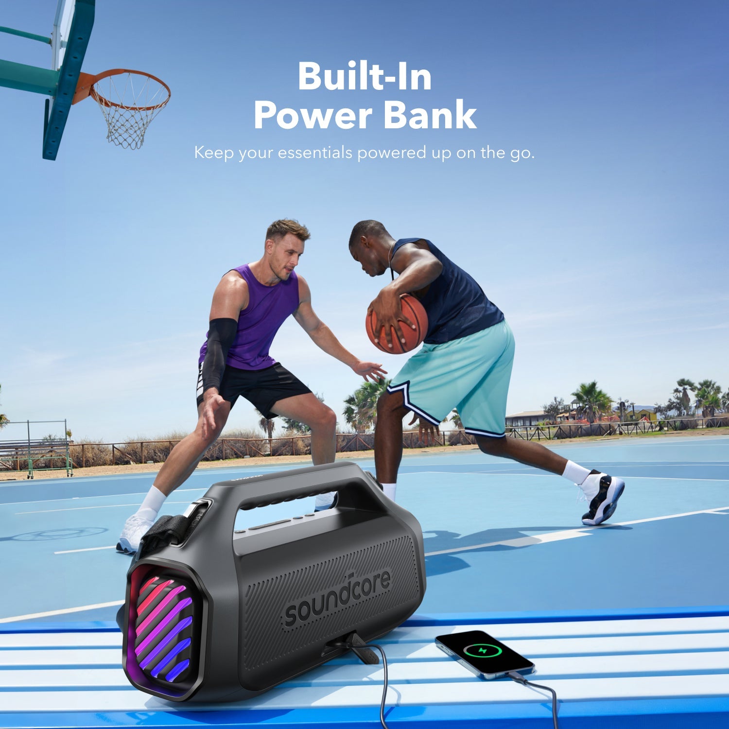 A Mobile Phone is Connected to Anker Soundcore Boom 2 Plus Portable Bluetooth Speaker  While Some People are Playing Basket Ball.