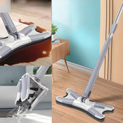 The mop is placed in a wooden floor and clean up a large spill. The mop head is being wrung out under running water.