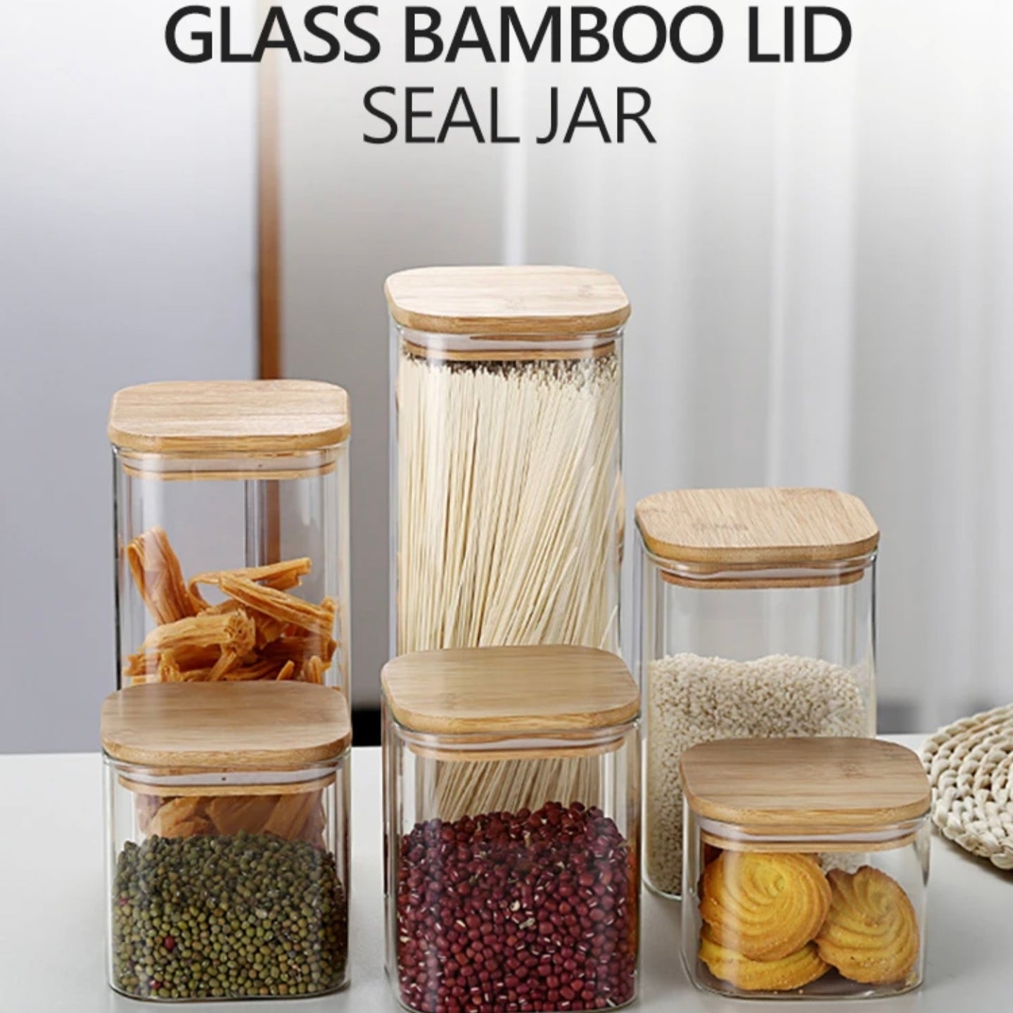 A Set Of Glass Storage Jars  are Filled with Beans and Snacks.