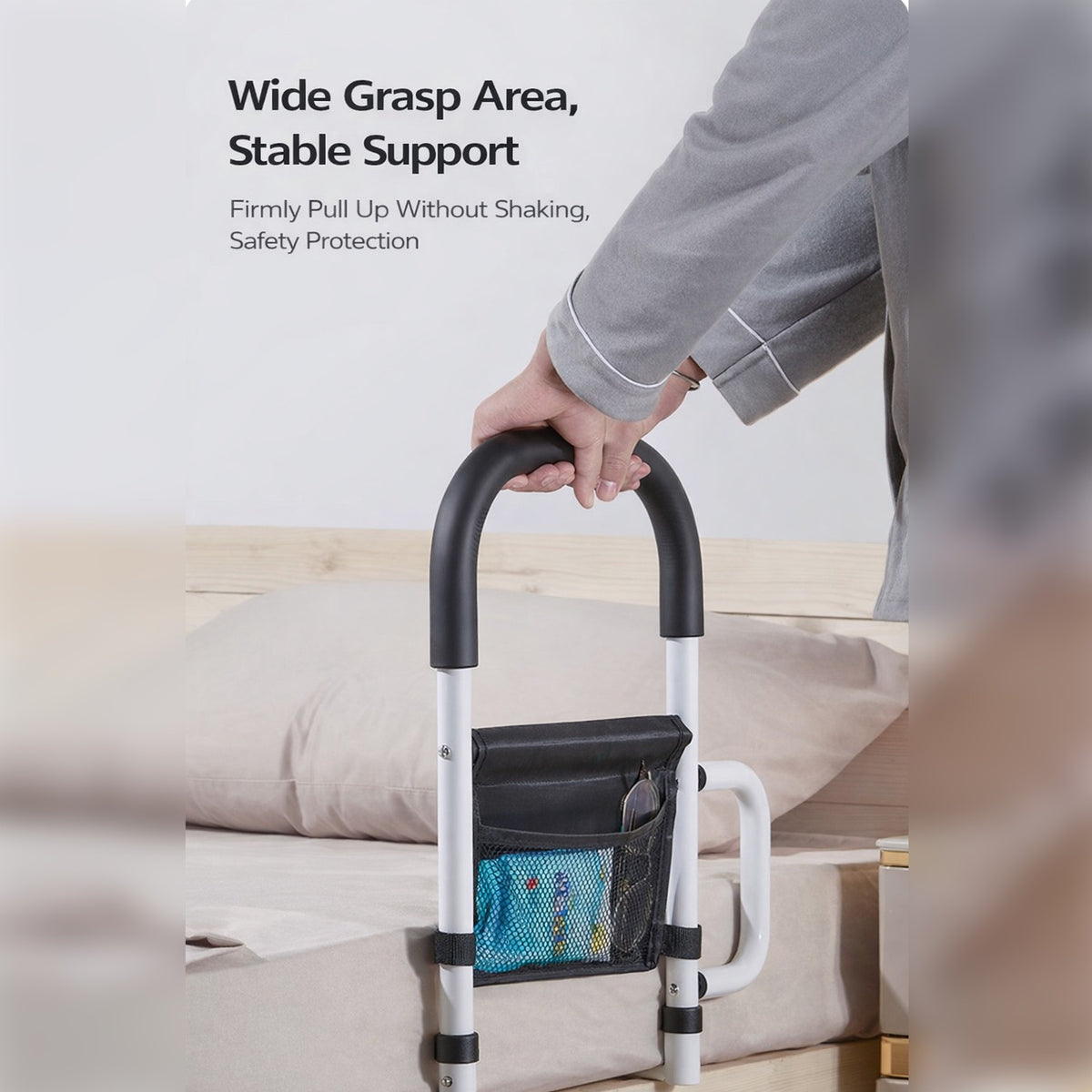 A Person is Standing with the aid of Bed Assist Rail with Safety Handle.