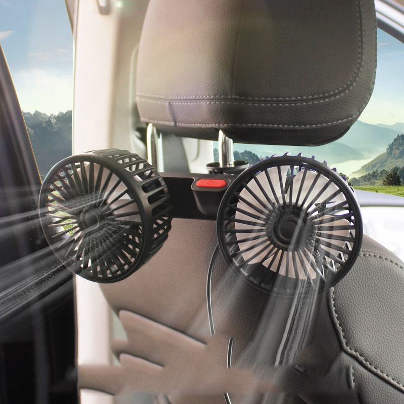 Rotating Mini Car Vehicle Cooling Double Headed Clip Lock Fan is Attached on Car Headrest.