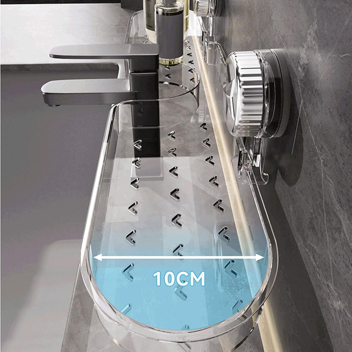 Size Details of Clear suction bathroom shelf mounted on a tiled bathroom wall above a sink, beside a modern black faucet.