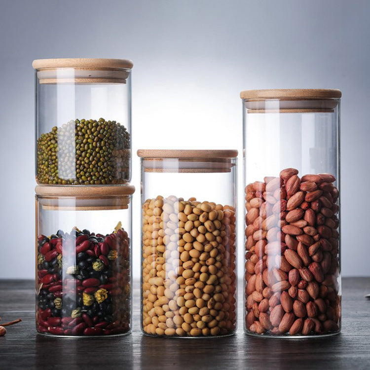 A Set Of Glass Storage Jars  are Filled with Dry Beans.
