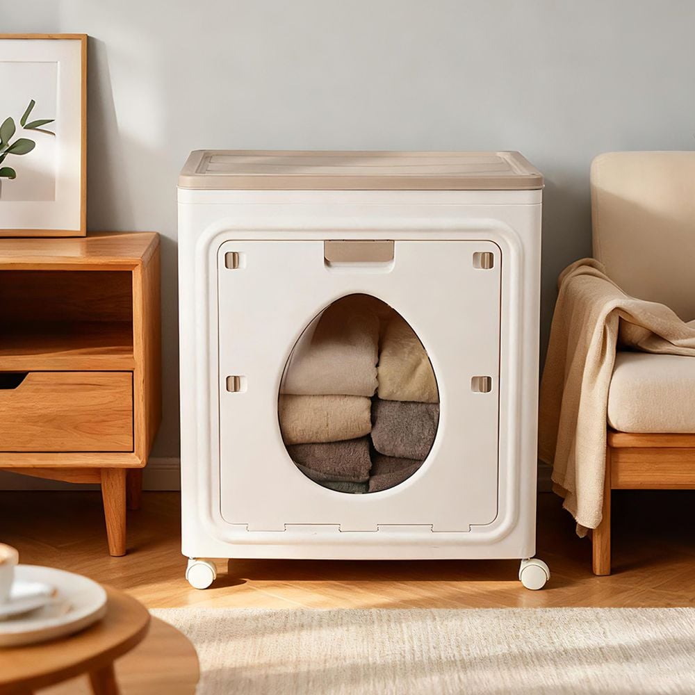 A Foldable Cloth Storage Organizer Box is kept on the side of modern room neatly filled with folded clothes.