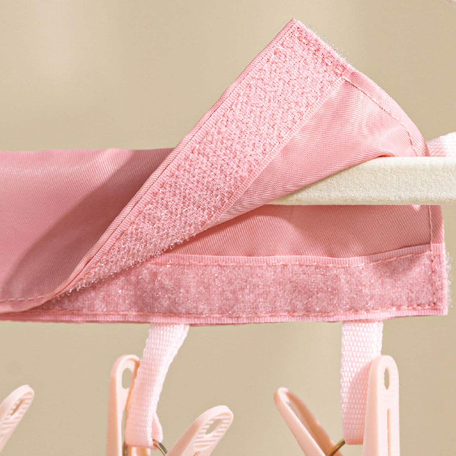 Pink open strap with clips on a hanger 