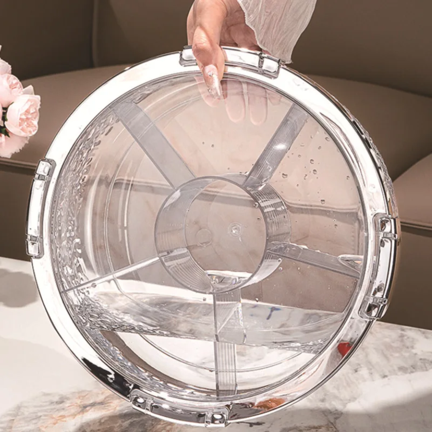 A Person is Holding Press-Down Vacuum Fruit Plate.