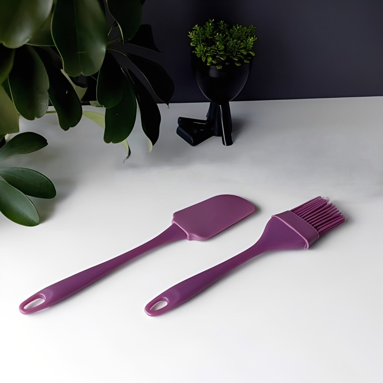 Brush and spatula placed on a white floor