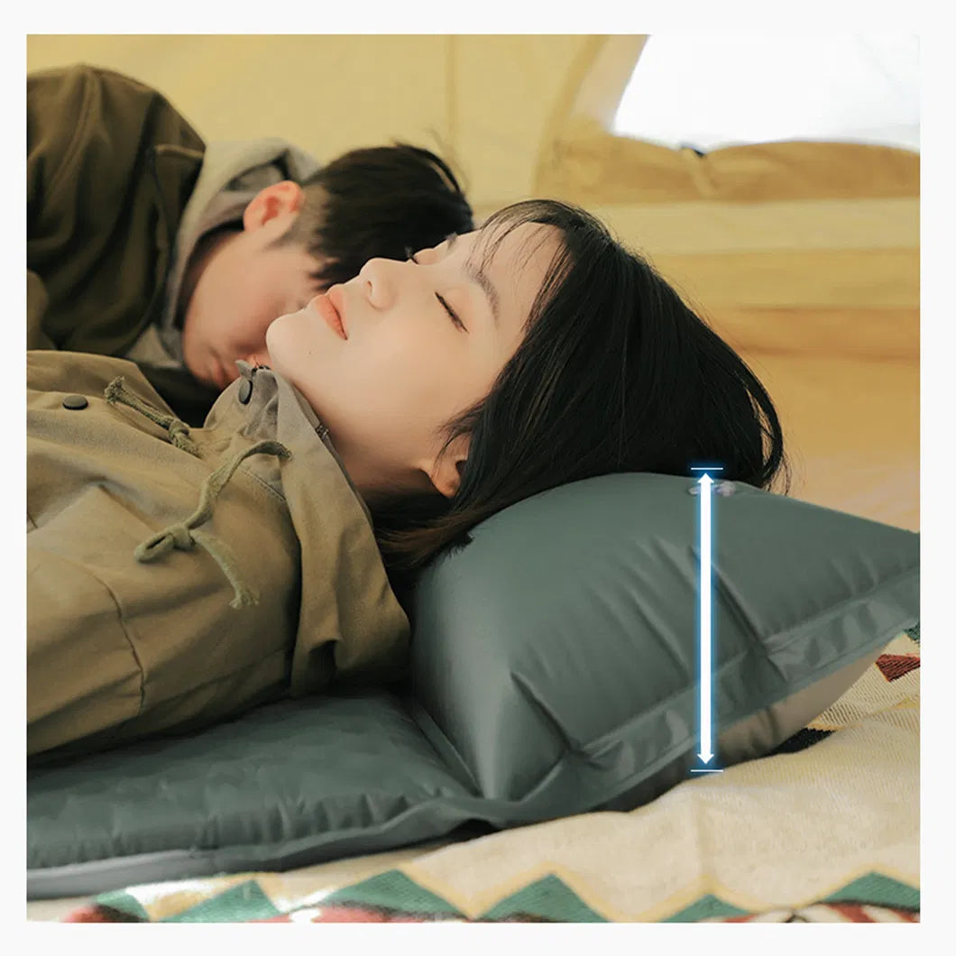 Couple sleeping inside a camping tent on a green self-inflating camping mattress with built-in pillow