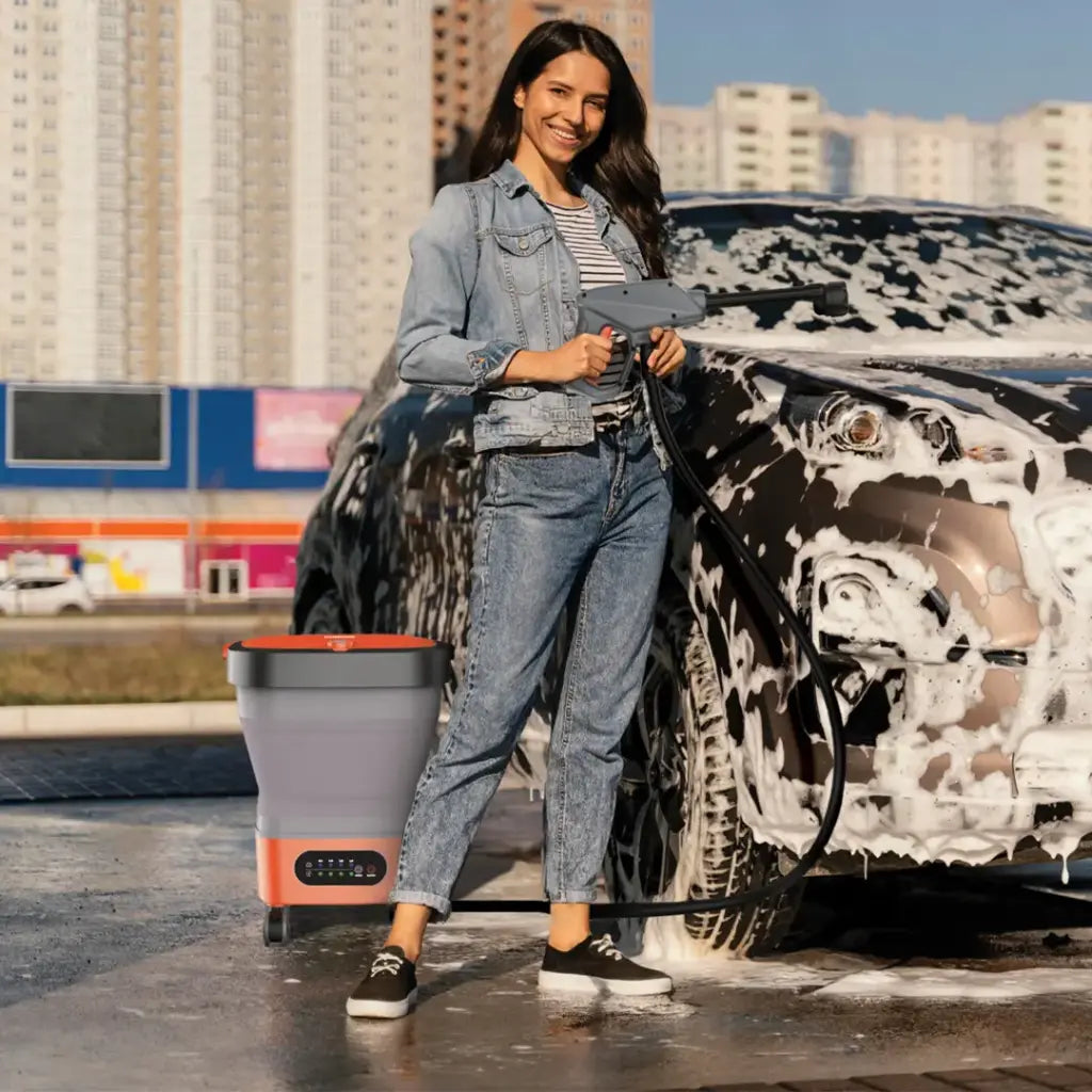 A Woman is washing car using Porodo AquaSpray Multifunctional Pressure Washer.