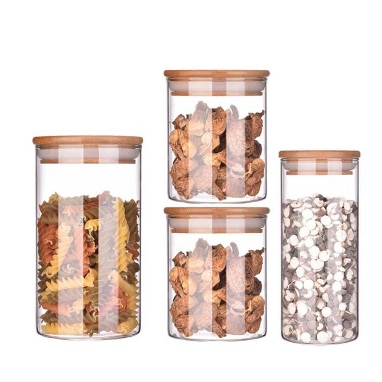 A Set Of Glass Storage Jars  are Filled with Spices.