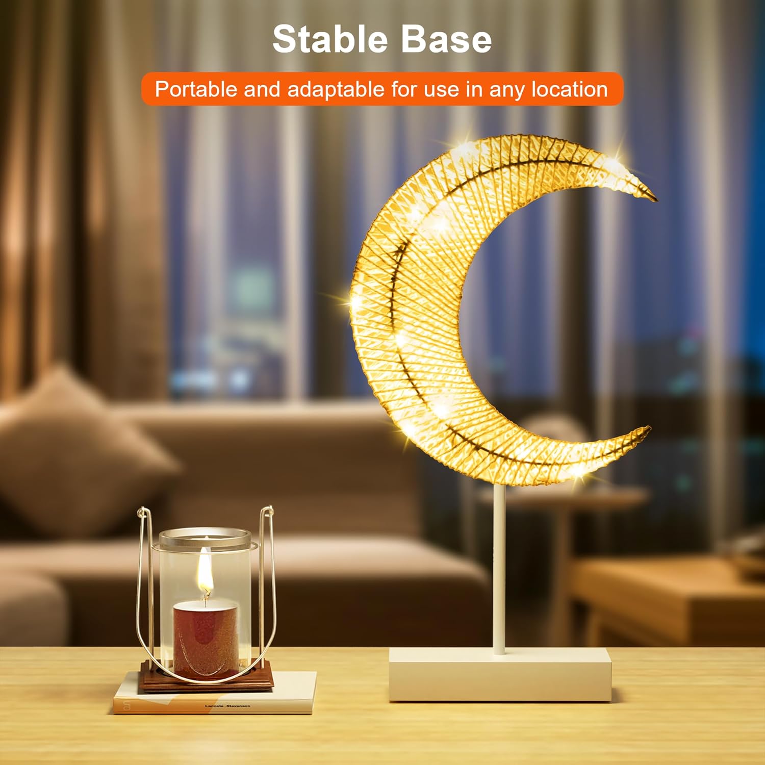 A LED Moon Table Lamp Decorative Night Light is Placed on a Table Along with Other Decor Items.