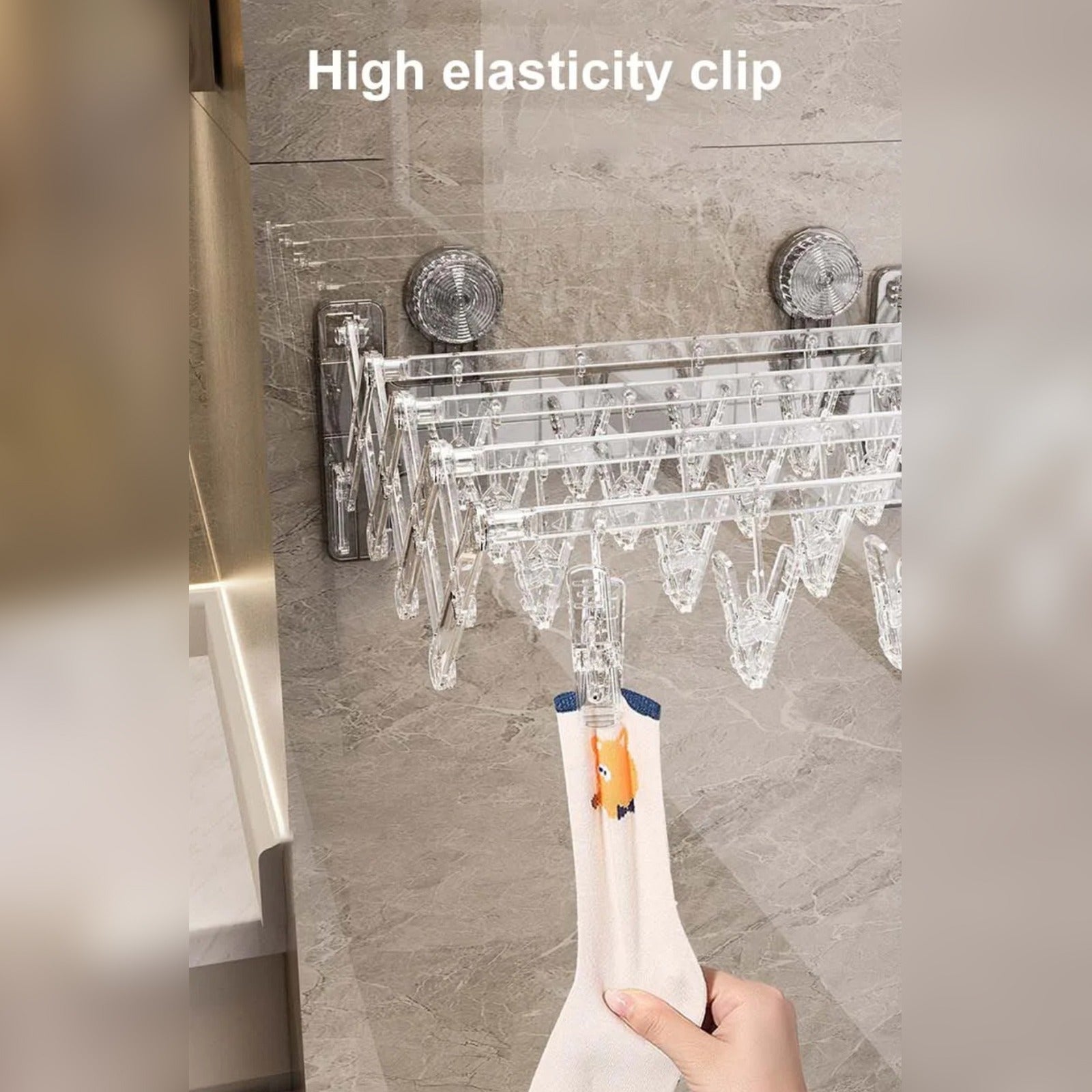 A Person is Pulling Socks From Wall Mounted Foldable Suction Cup Sock Cloth Drying Hanger Rack.