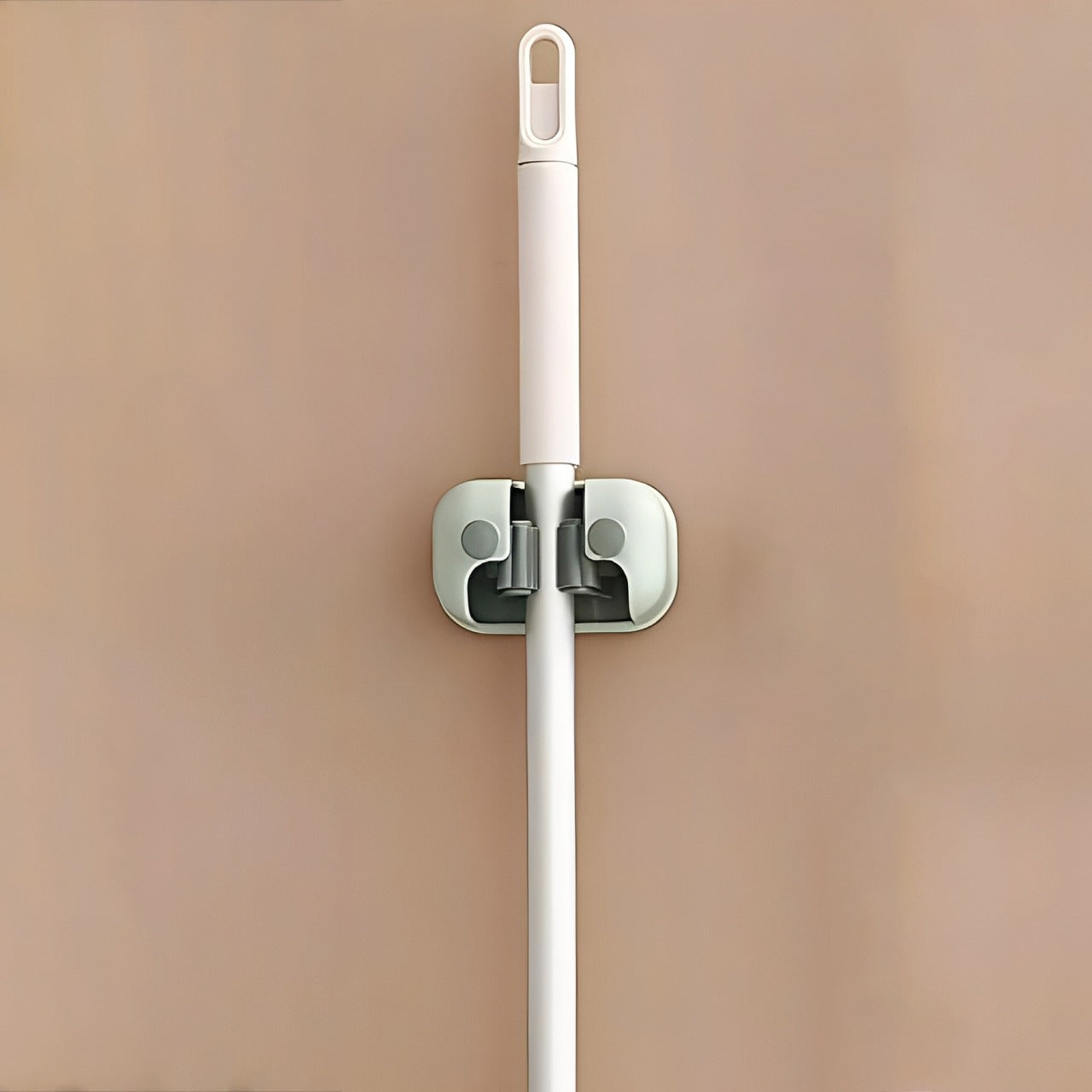 Mop is Organized on Wall Mounted Single Mop Holder.