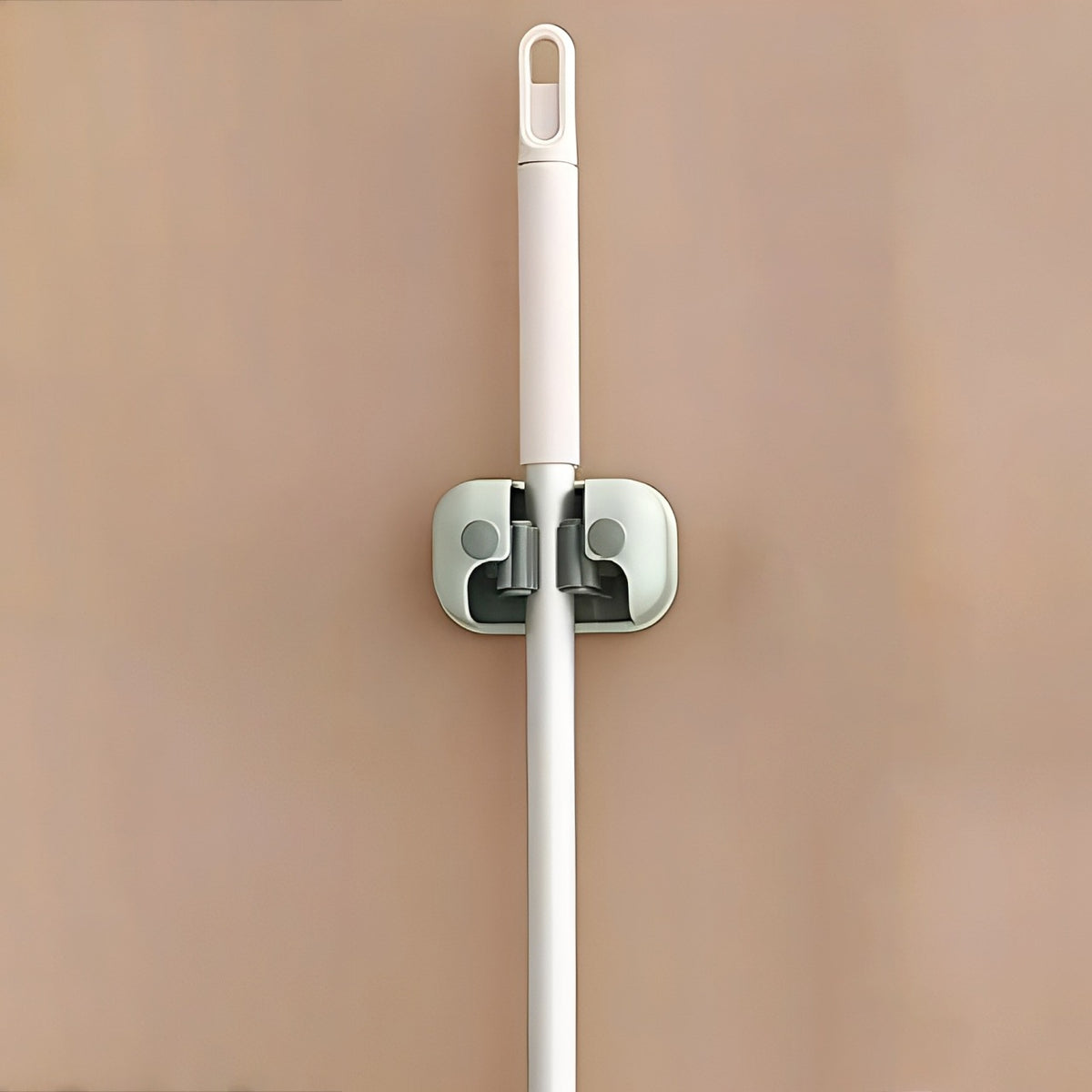 Mop is Organized on Wall Mounted Single Mop Holder.