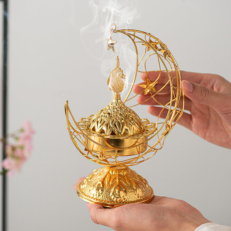 A Person is holding Ramadan Crescent Bukhoor Burner.