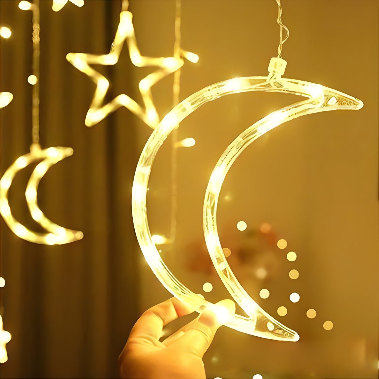 A Person is Holding Ramadan Kareem LED String Lights with Moon & Star.